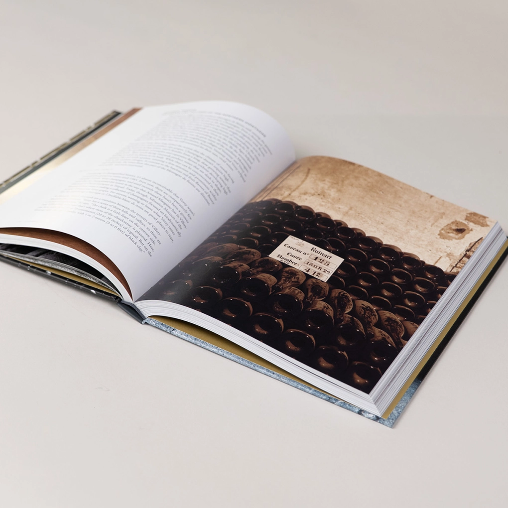 An interior spread, with a photograph of a wine barrels.